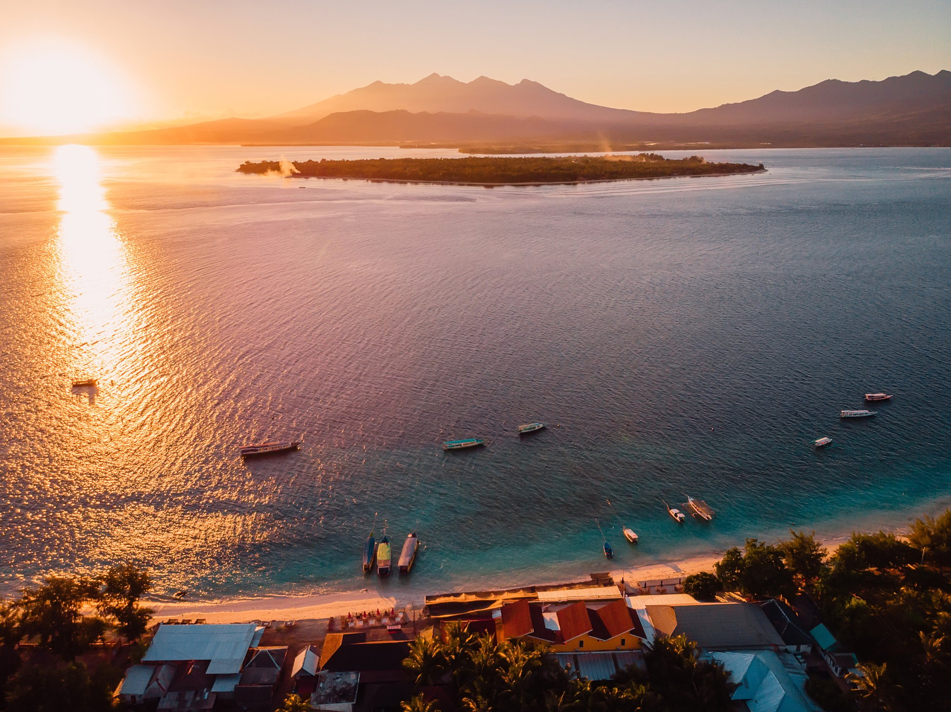 Aerial view with Gili islands, ocean and sunrise. Gili Meno, Gili Air and Lombok